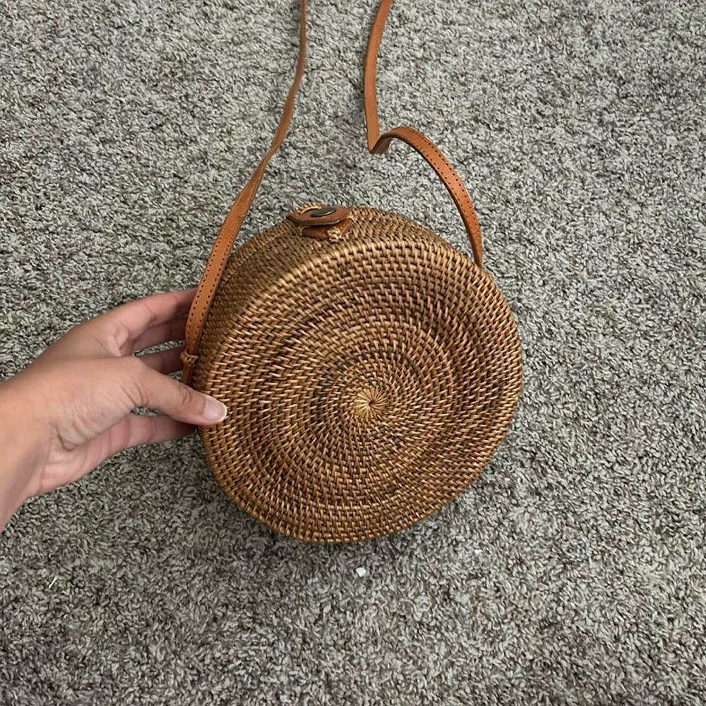 Round woven crossbody bag.